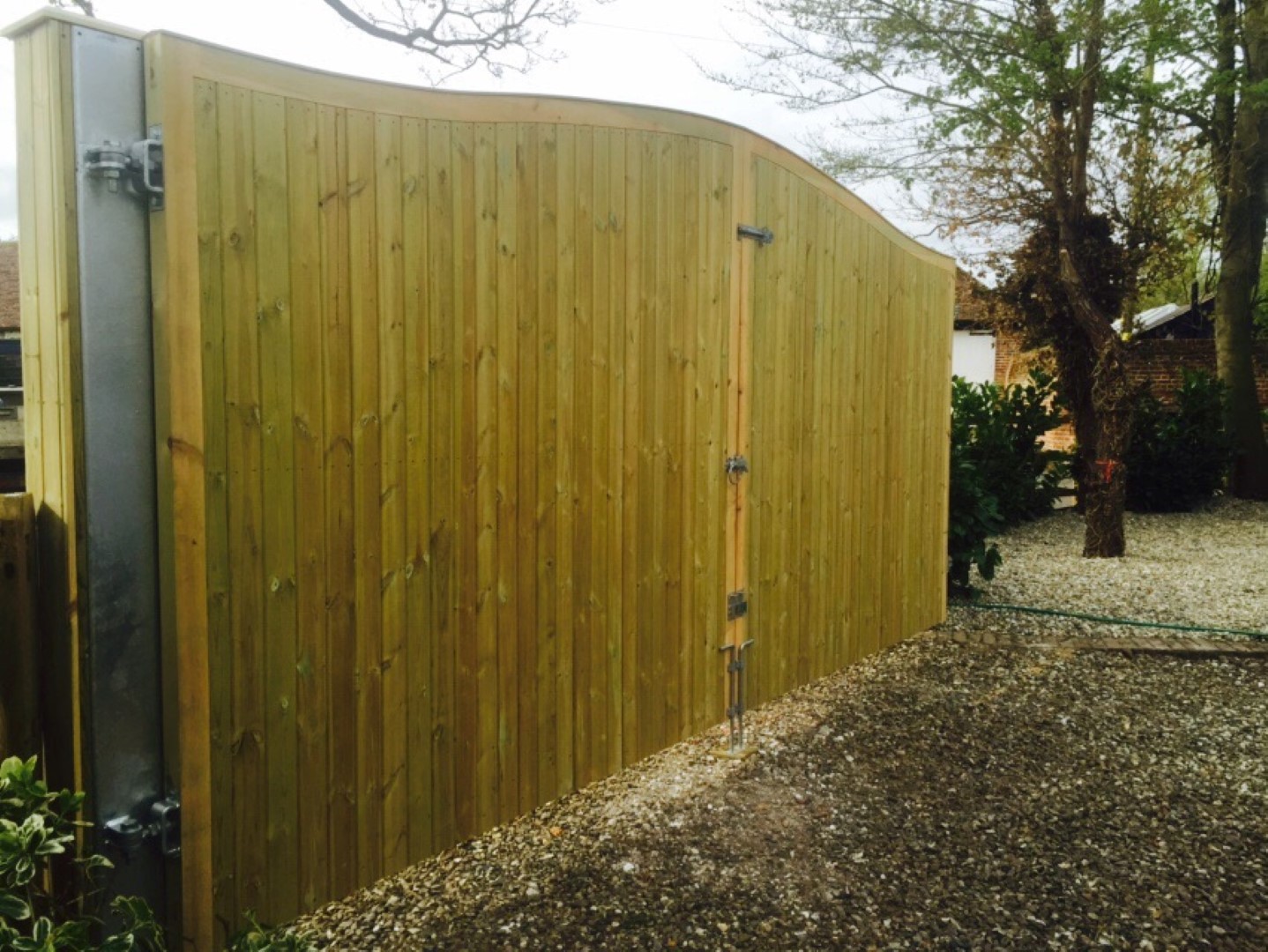 Metal inner framed gates with v-joint cladding to the posts. The gates are our omega top.